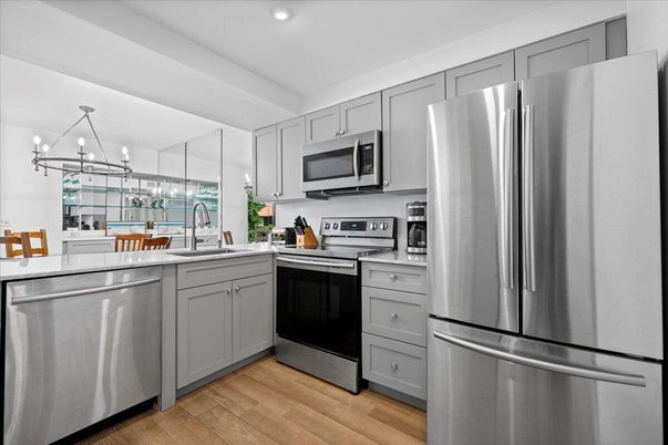 Interior, Kitchen, Pendant Lights, Recessed Lighting, Stainless Steel Appliances, Wood Texture Flooring