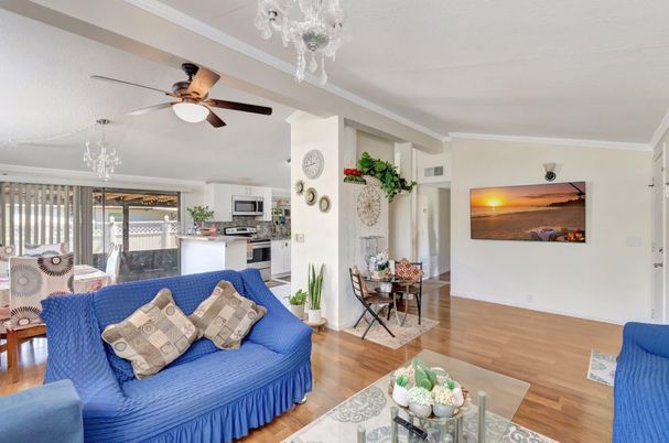 Chandelier, Dining room, Interior, Kitchen, Living room, Stainless Steel Appliances, Wood Texture Flooring