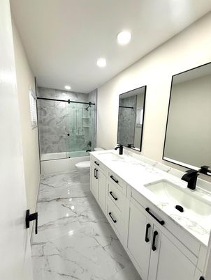 Bathroom, Dual Sink Vanities, Glass Shower, Interior, Marble, Marble Walls, Recessed Lighting