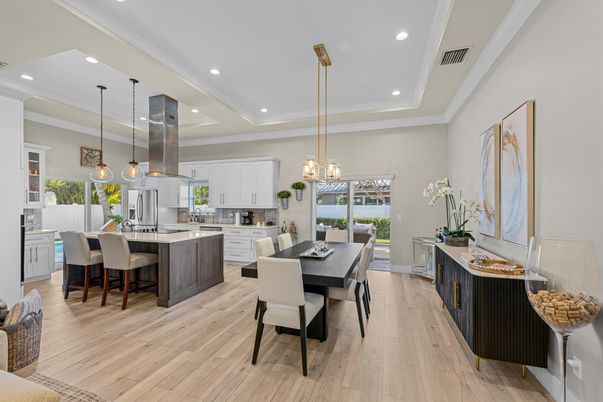 Chandelier, Dining room, Interior, Kitchen, Pendant Lights, Recessed Lighting, Stainless Steel Appliances, Wood Texture Flooring
