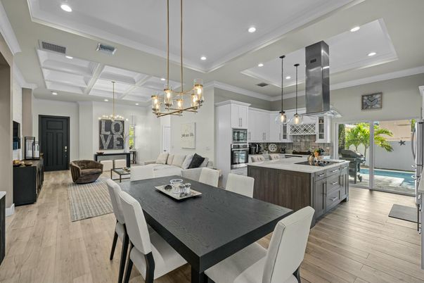 Chandelier, Dining room, Interior, Kitchen, Living room, Pendant Lights, Recessed Lighting, Stainless Steel Appliances, Wood Texture Flooring