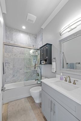 Bathroom, Glass Shower, Interior, Marble Walls, Recessed Lighting, Wood Texture Flooring
