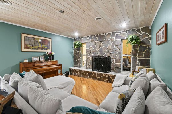 Fireplace, Interior, Living room, Piano, Recessed Lighting, Stone Walls, Wooden Ceilings, Wood Texture Flooring
