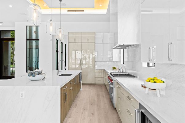 Interior, Kitchen, Marble Walls, Pendant Lights, Recessed Lighting, Stainless Steel Appliances, Wood Texture Flooring