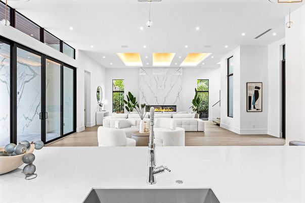 Fireplace, Interior, Living room, Marble Walls, Pendant Lights, Recessed Lighting, Wood Texture Flooring