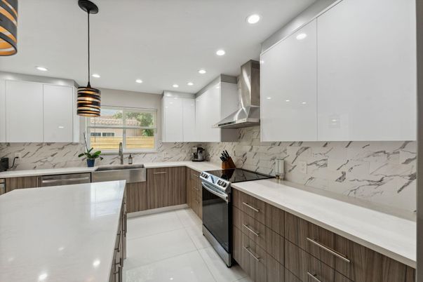 Interior, Kitchen, Marble Walls, Pendant Lights, Recessed Lighting, Stainless Steel Appliances