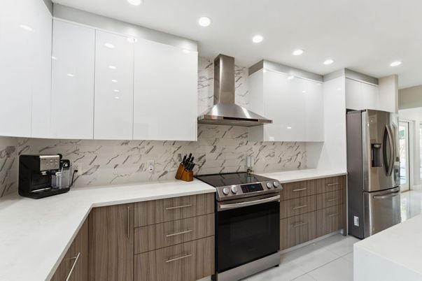 Interior, Kitchen, Marble Walls, Recessed Lighting, Stainless Steel Appliances
