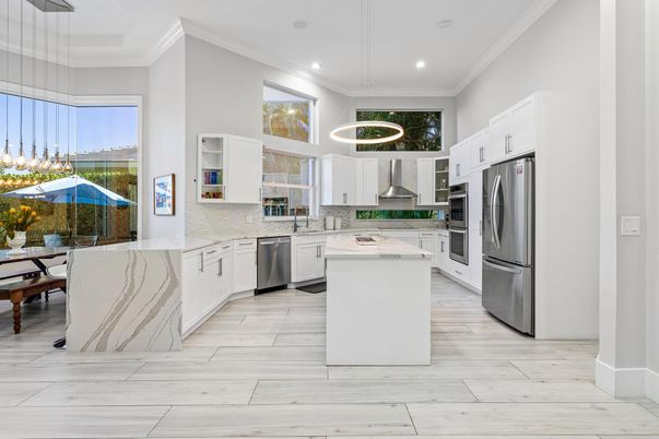 Dining room, Interior, Kitchen, Pendant Lights, Recessed Lighting, Stainless Steel Appliances, Wood Texture Flooring