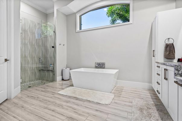 Bathroom, Free Standing Baths, Glass Shower, Interior, Recessed Lighting, Wood Texture Flooring