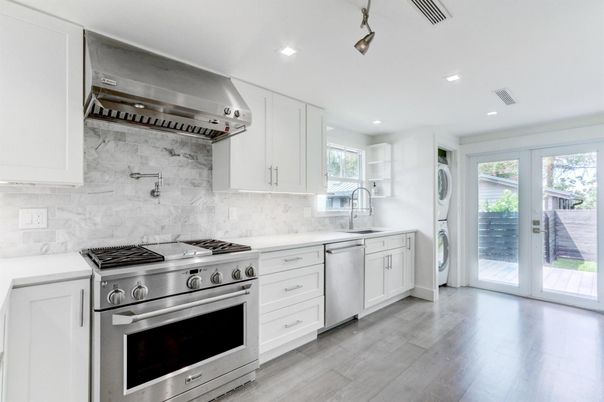 Interior, Kitchen, Marble Walls, Recessed Lighting, Stainless Steel Appliances, Wood Texture Flooring