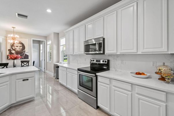 Interior, Kitchen, Marble Walls, Recessed Lighting, Stainless Steel Appliances
