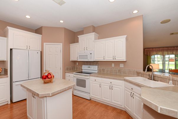 Interior, Kitchen, Recessed Lighting, Tile Countertops, Wood Texture Flooring