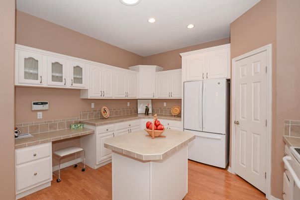 Interior, Kitchen, Recessed Lighting, Tile Countertops, Wood Texture Flooring