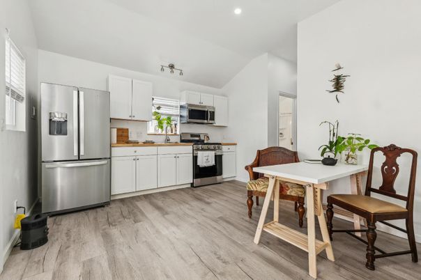 Dining room, Interior, Kitchen, Recessed Lighting, Stainless Steel Appliances, Wood Texture Flooring