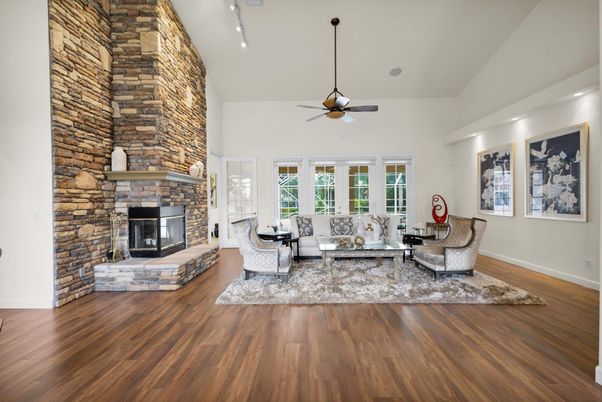 Fireplace, Interior, Living room, Recessed Lighting, Stone Walls, Wood Texture Flooring