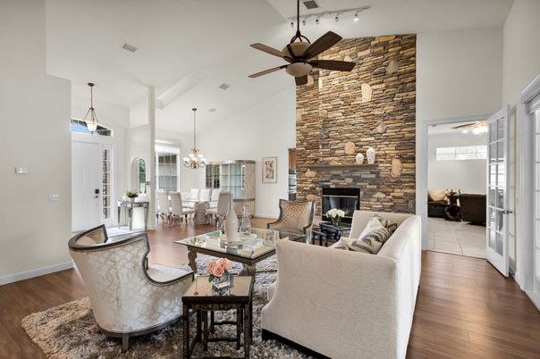 Chandelier, Dining room, Fireplace, Interior, Living room, Pendant Lights, Stone Walls, Wood Texture Flooring