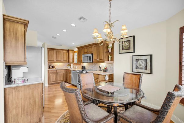 Chandelier, Dining room, Interior, Kitchen, Recessed Lighting, Stainless Steel Appliances, Wood Texture Flooring