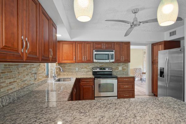 Interior, Kitchen, Recessed Lighting, Stainless Steel Appliances, Stone Walls