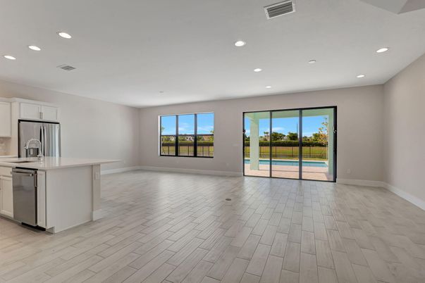 Empty room, Interior, Kitchen, Recessed Lighting, Stainless Steel Appliances, Wood Texture Flooring