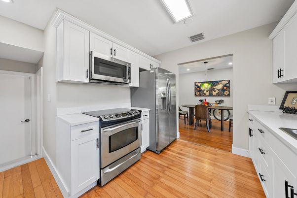 Dining room, Interior, Kitchen, Pendant Lights, Recessed Lighting, Stainless Steel Appliances, Wood Texture Flooring