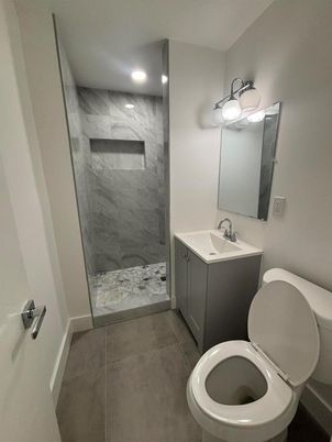 Bathroom, Dual Sink Vanities, Glass Shower, Interior, Marble Walls, Recessed Lighting