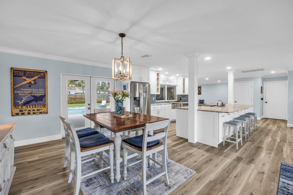 Dining room, Interior, Kitchen, Pendant Lights, Recessed Lighting, Stainless Steel Appliances, Wood Texture Flooring