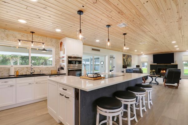 Fireplace, Interior, Kitchen, Pendant Lights, Recessed Lighting, Stainless Steel Appliances, Wooden Ceilings, Wood Texture Flooring