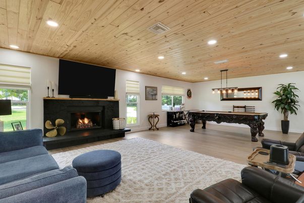 Billiard Table, Dining room, Fireplace, Game Room, Interior, Living room, Pendant Lights, Recessed Lighting, Wooden Ceilings, Wood Texture Flooring
