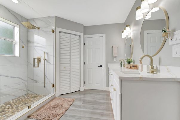 Bathroom, Dual Sink Vanities, Glass Shower, Interior, Marble Walls, Recessed Lighting, Wood Texture Flooring