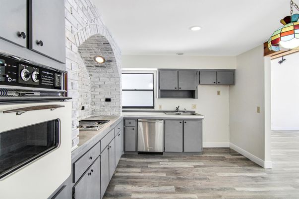 Interior, Kitchen, Recessed Lighting, Stainless Steel Appliances, Stone Walls, Wood Texture Flooring