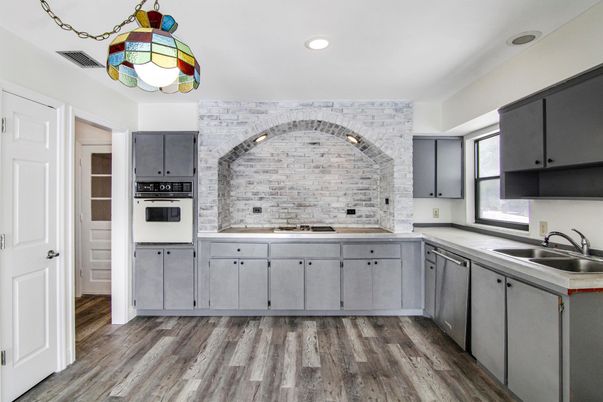 Interior, Kitchen, Recessed Lighting, Stainless Steel Appliances, Stone Walls, Wood Texture Flooring