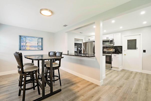Dining room, Interior, Kitchen, Recessed Lighting, Stainless Steel Appliances, Wood Texture Flooring