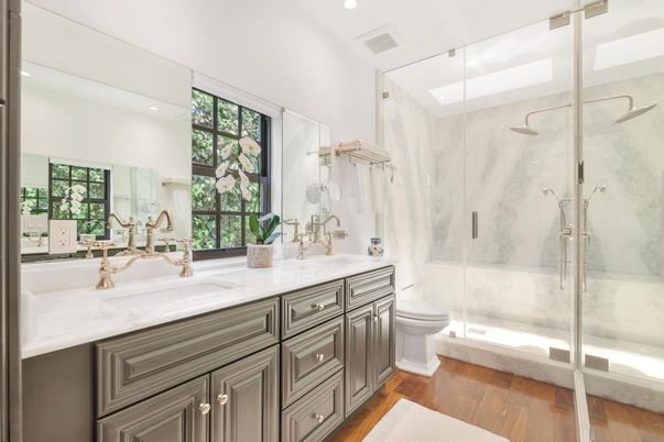 Bathroom, Dual Sink Vanities, Glass Shower, Interior, Marble Walls, Recessed Lighting, Wood Texture Flooring