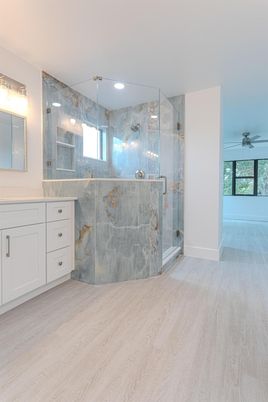 Bathroom, Glass Shower, Interior, Marble Walls, Recessed Lighting, Wood Texture Flooring