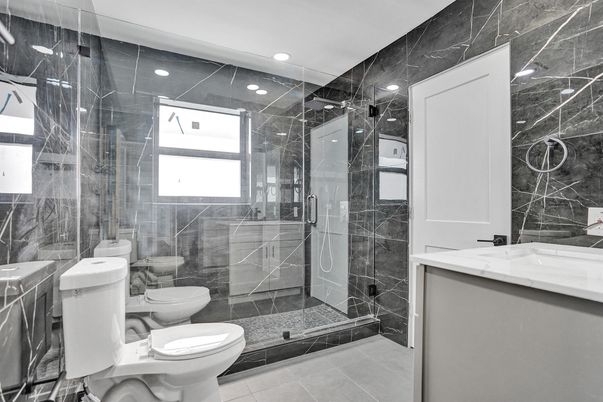 Bathroom, Dual Sink Vanities, Glass Shower, Interior, Marble Walls, Recessed Lighting