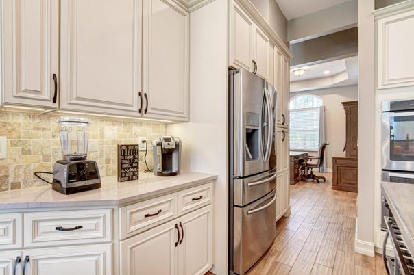 Dining room, Interior, Kitchen, Recessed Lighting, Stainless Steel Appliances, Stone Walls, Wood Texture Flooring