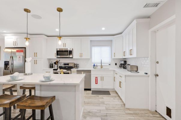 Interior, Kitchen, Pendant Lights, Recessed Lighting, Stainless Steel Appliances, Wood Texture Flooring