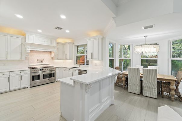 Chandelier, Dining room, Interior, Kitchen, Recessed Lighting, Stainless Steel Appliances, Wood Texture Flooring