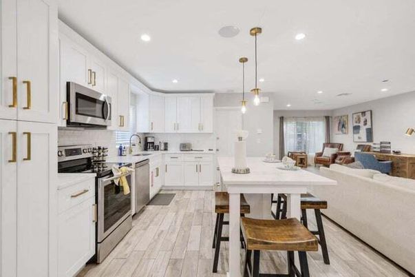 Dining room, Interior, Kitchen, Living room, Pendant Lights, Recessed Lighting, Stainless Steel Appliances, Wood Texture Flooring
