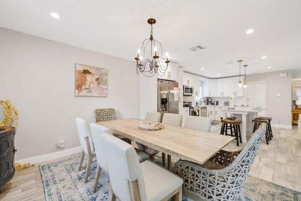 Chandelier, Dining room, Interior, Kitchen, Pendant Lights, Recessed Lighting, Stainless Steel Appliances, Wood Texture Flooring