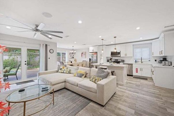 Chandelier, Dining room, Interior, Kitchen, Living room, Pendant Lights, Recessed Lighting, Stainless Steel Appliances, Wood Texture Flooring