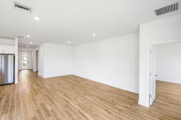 Empty room, Interior, Kitchen, Recessed Lighting, Stainless Steel Appliances, Wood Texture Flooring