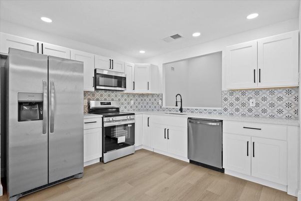 Interior, Kitchen, Recessed Lighting, Stainless Steel Appliances, Wood Texture Flooring