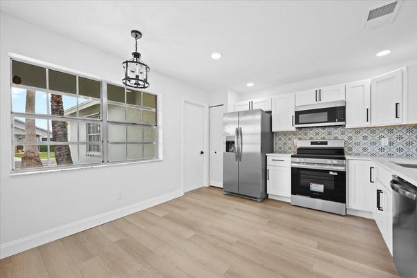 Interior, Kitchen, Pendant Lights, Recessed Lighting, Stainless Steel Appliances, Wood Texture Flooring