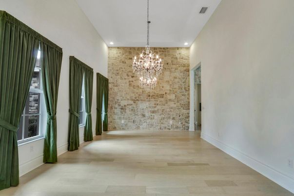 Chandelier, Empty room, Interior, Recessed Lighting, Stone Walls, Wood Texture Flooring