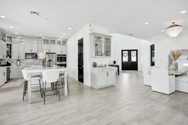 Chandelier, Dining room, Interior, Kitchen, Recessed Lighting, Stainless Steel Appliances, Wood Texture Flooring