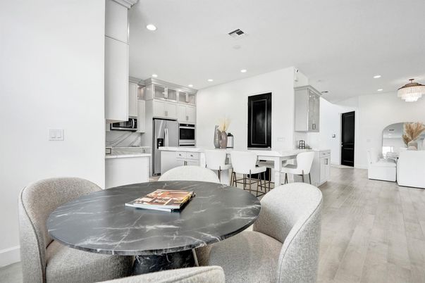 Dining room, Interior, Kitchen, Pendant Lights, Recessed Lighting, Stainless Steel Appliances, Wood Texture Flooring