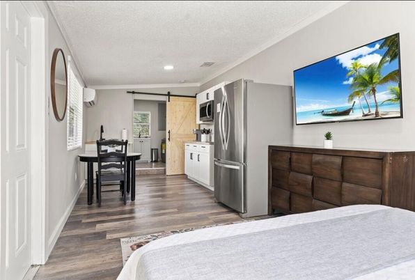 Bedroom, Dining room, Interior, Kitchen, Recessed Lighting, Stainless Steel Appliances, Wood Texture Flooring