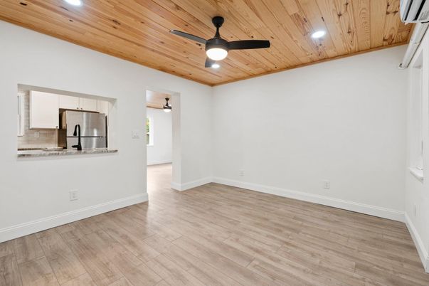 Empty room, Interior, Kitchen, Recessed Lighting, Stainless Steel Appliances, Wooden Ceilings, Wood Texture Flooring