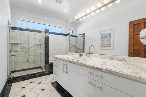 Bathroom, Dual Sink Vanities, Glass Shower, Interior, Marble, Marble Walls, Recessed Lighting